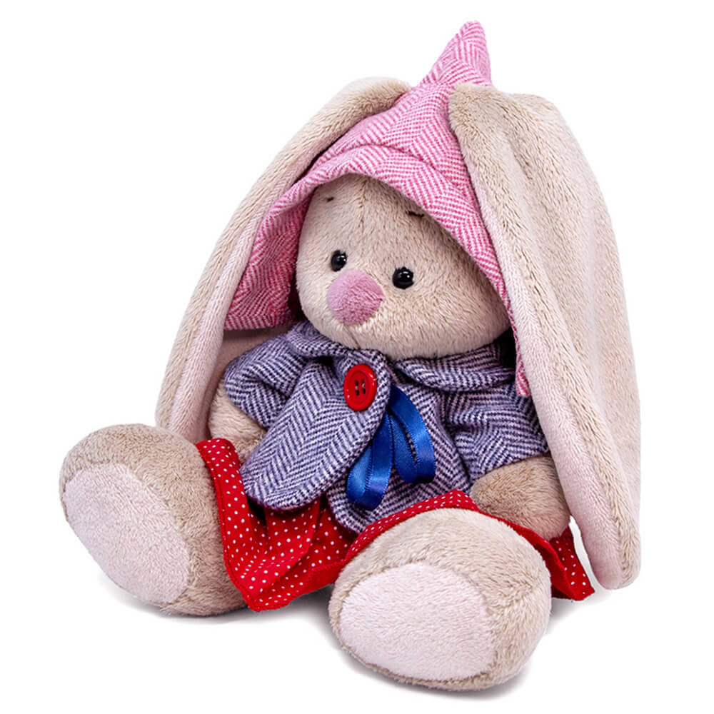 in a tweed suit with a skirt