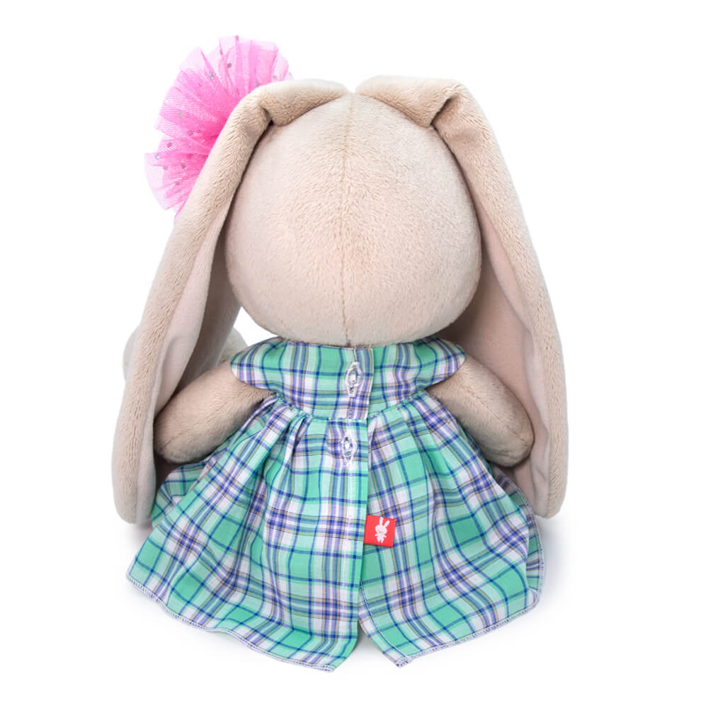 in a green plaid dress
