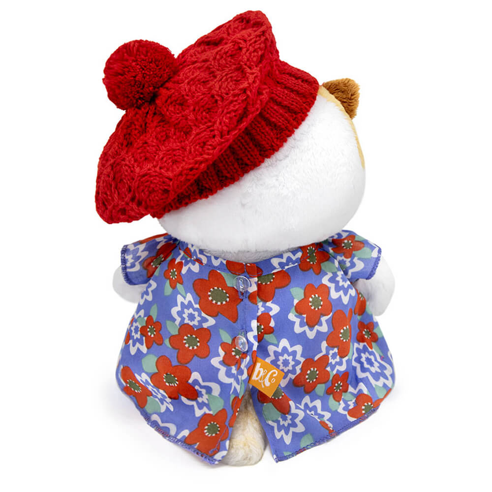 in a dress and an openwork beret
