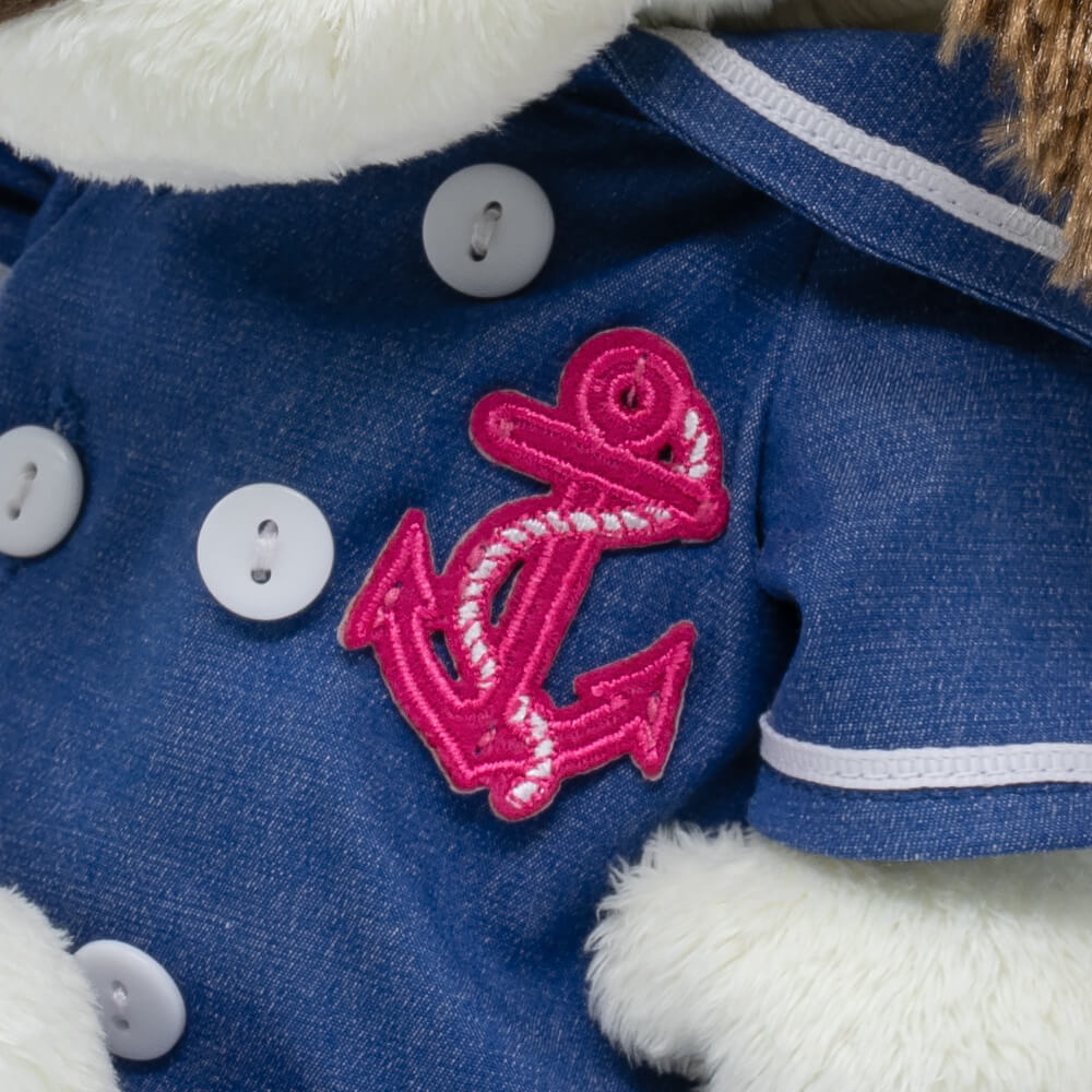 in overalls with an anchor