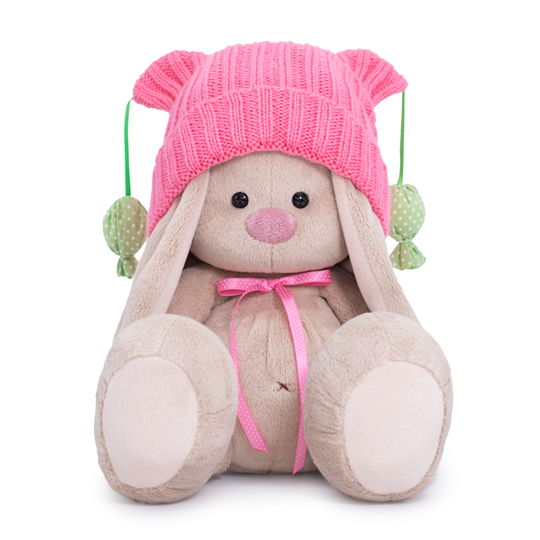 in a pink hat with pompons