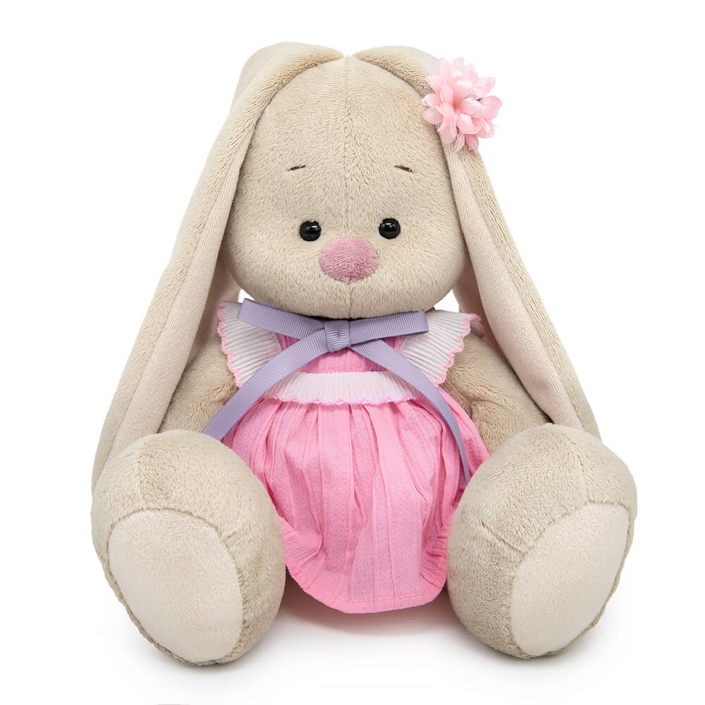 in a dress with a lavender bow