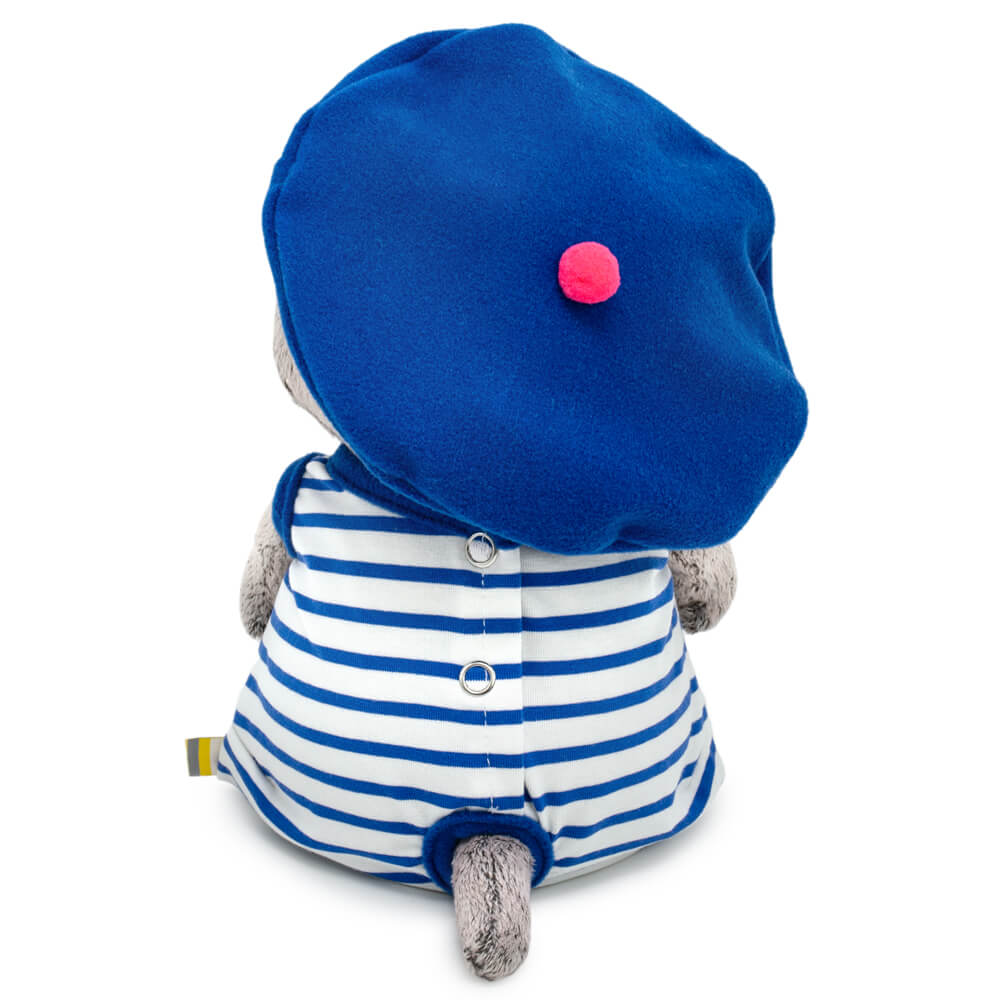 in striped overalls and a beret