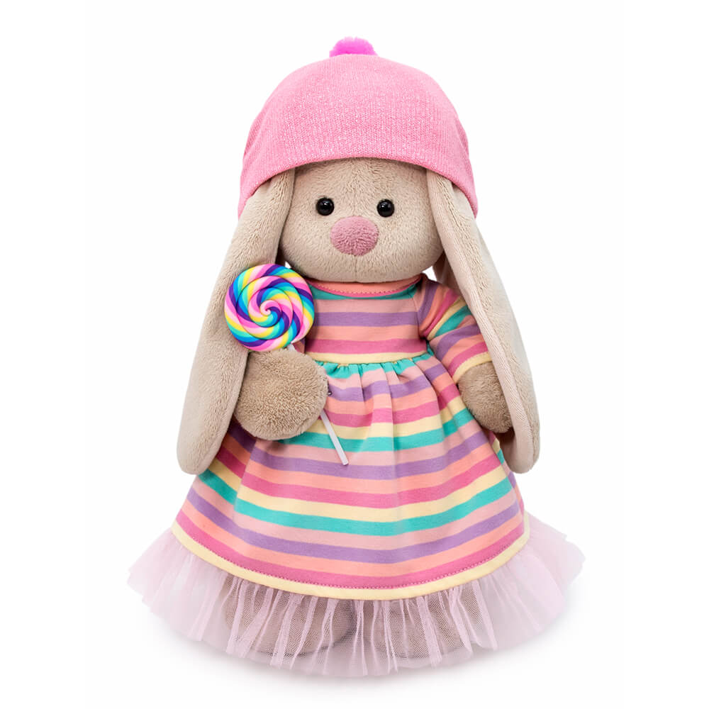 in a striped dress with a lollipop
