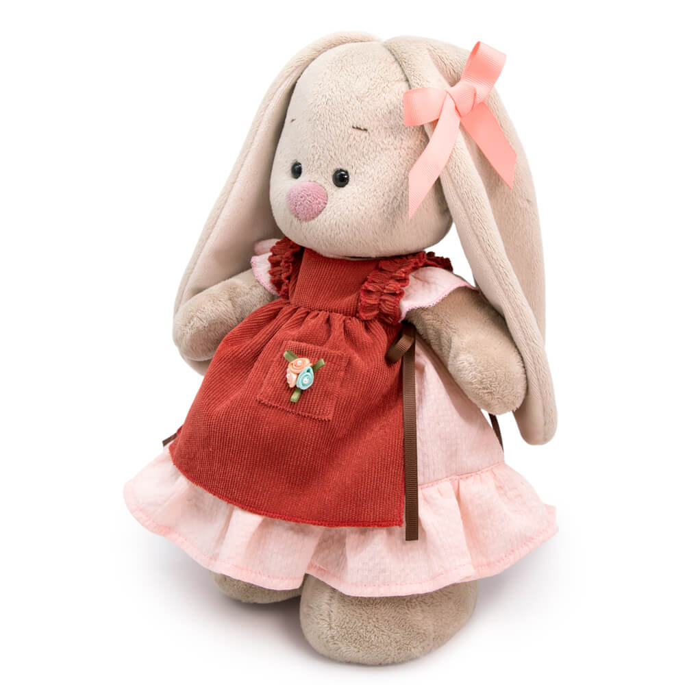 in a dress and apron with ruffles
