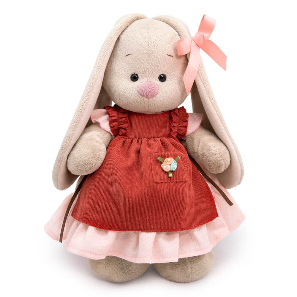 in a dress and apron with ruffles