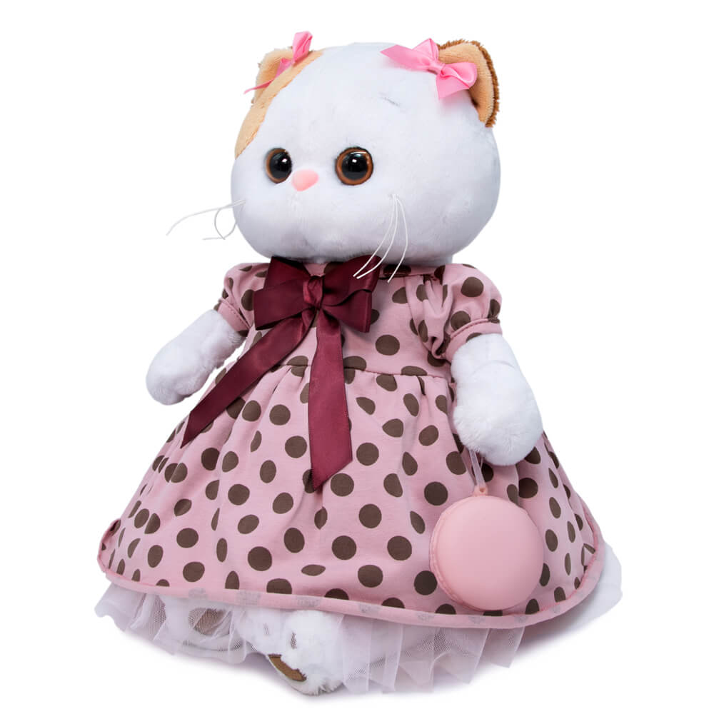in a pink dress with polka dots