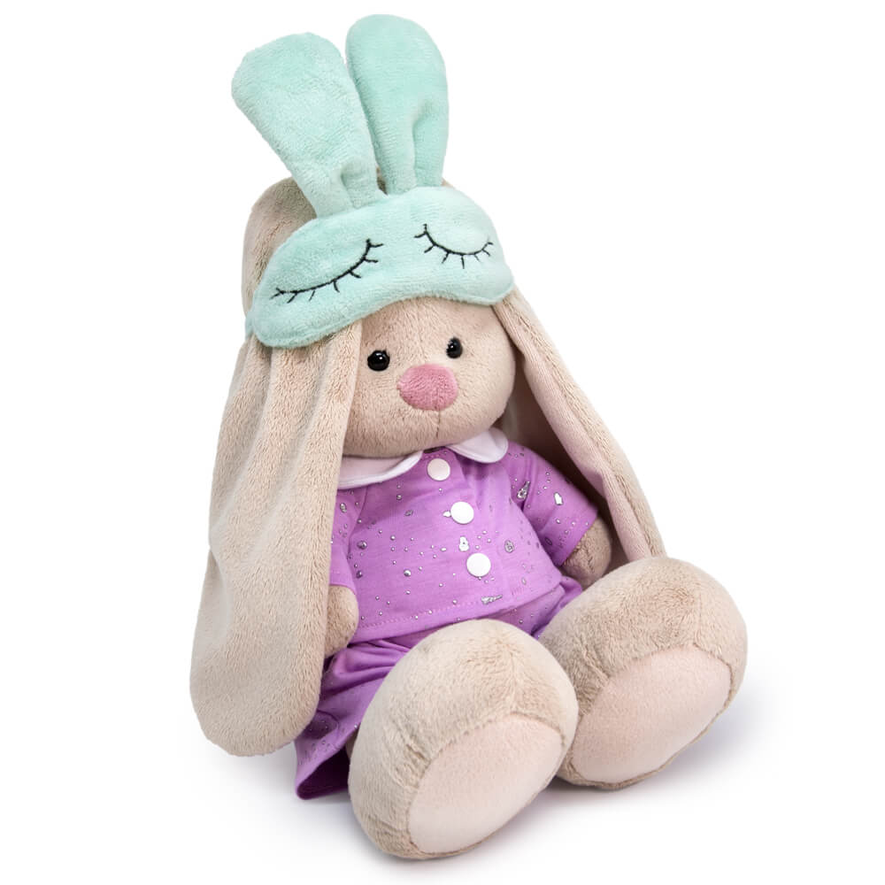 in pajamas with a sleep mask