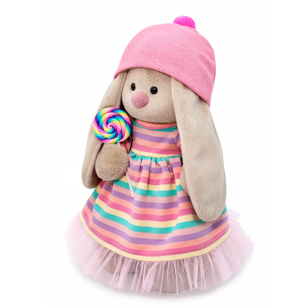 in a striped dress with a lollipop