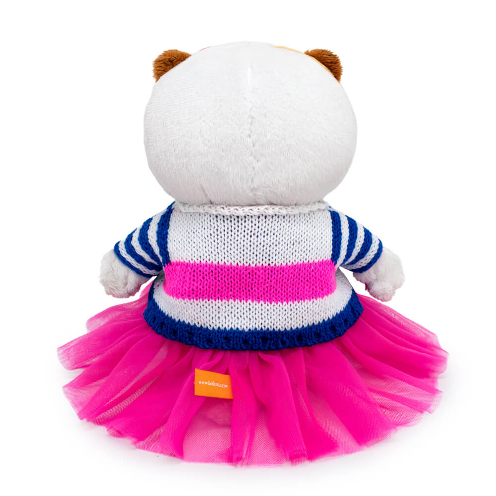 in a striped sweater and skirt
