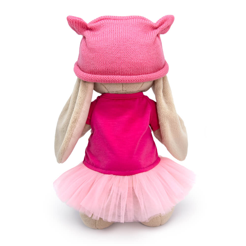 in a dress and cap with ears