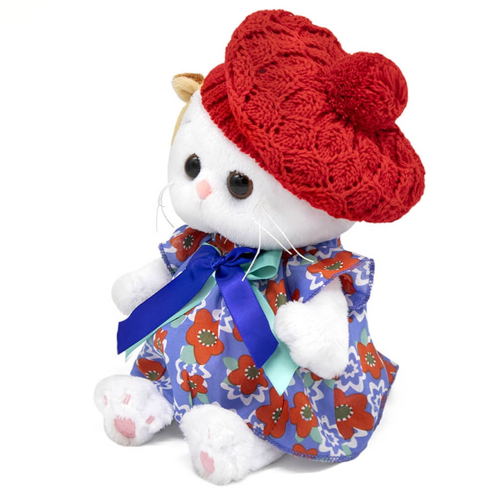 in a dress and an openwork beret
