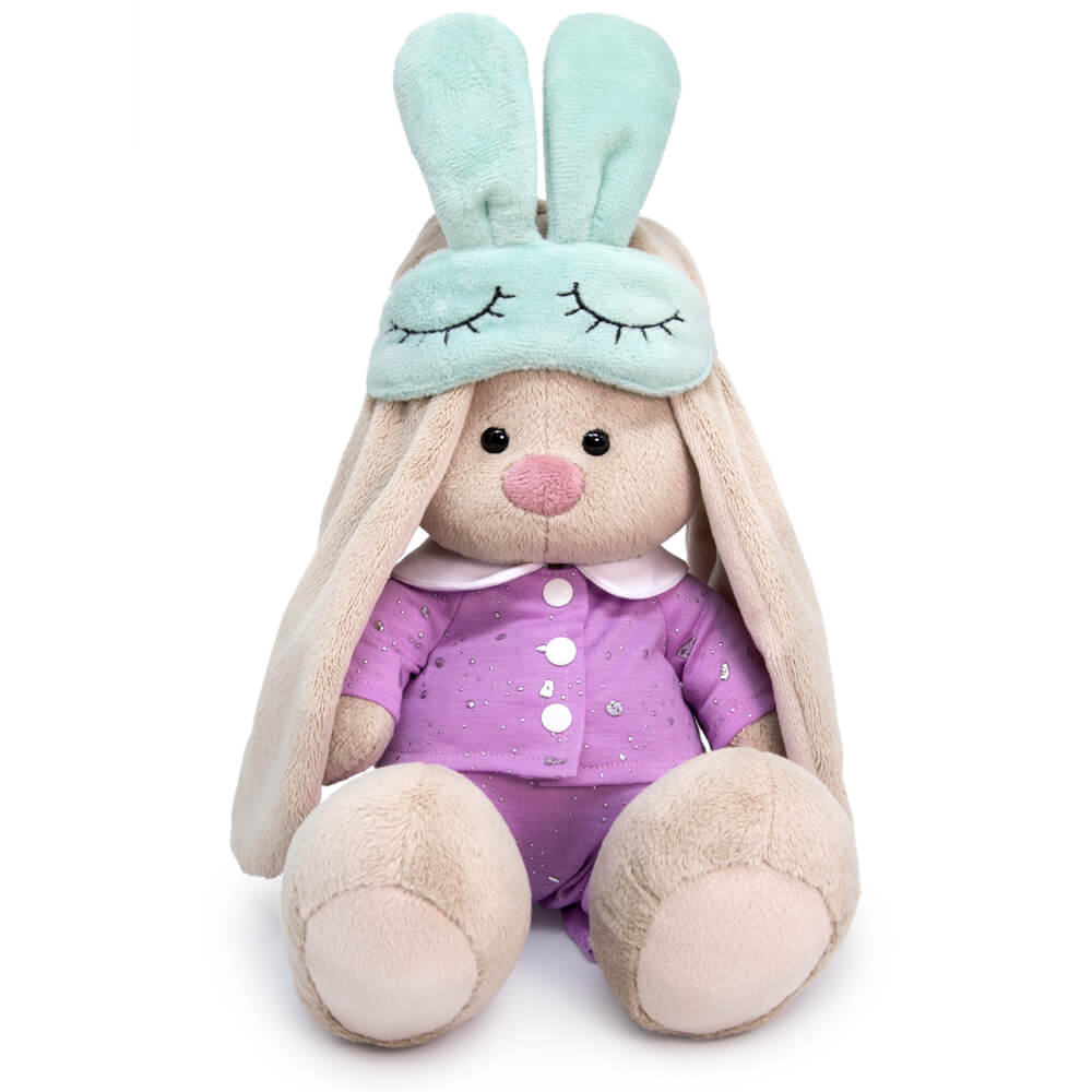 in pajamas with a sleep mask