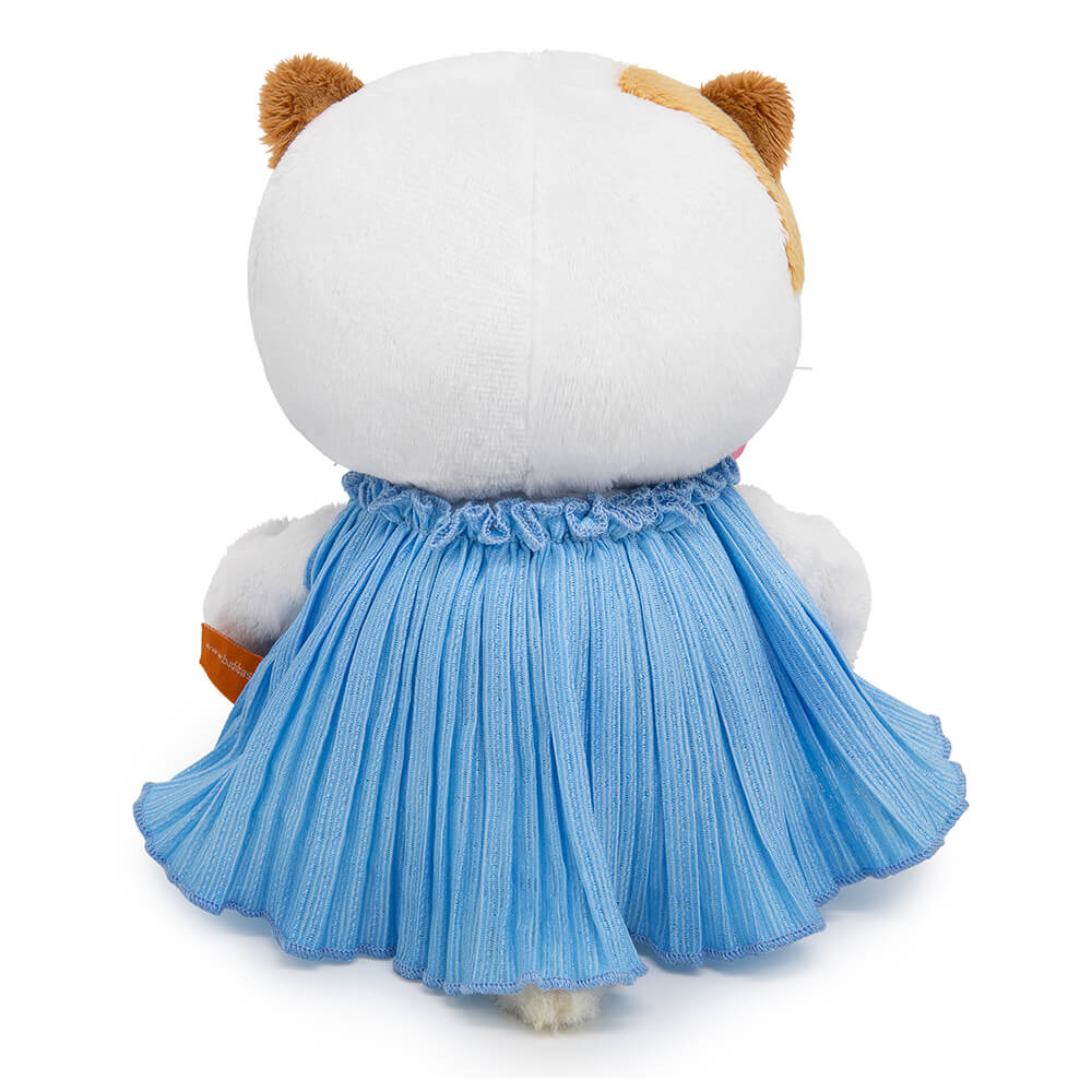 in a crinkled dress with a bow