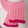in pink hat and scarf