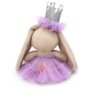 in a crown and a lilac fluffy mesh skirt