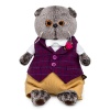 in a burgundy vest with a rose