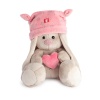 in pink hat with heart