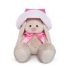 in a pink panama hat and a bow