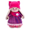 in a dress with snood and hat