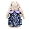 in a coat with lilac collar