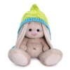in a cap with tassels