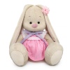 in a dress with a lavender bow