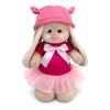 in a dress and cap with ears
