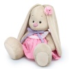 in a dress with a lavender bow
