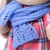 in a blue scarf