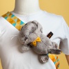 Basik cat with a bow reclining on Velcro