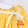 in yellow dress with pinafore