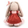 in a dress and apron with ruffles