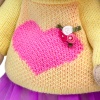in a sweater with a heart
