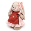 in a dress and apron with ruffles