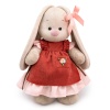 in a dress and apron with ruffles