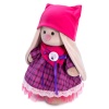 in a dress with snood and hat