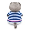 in a striped sweater and trousers