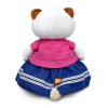 in a jacket with a bow and a skirt