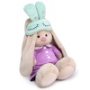 in pajamas with a sleep mask