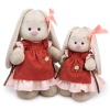 in a dress and apron with ruffles
