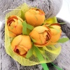 with a bouquet of orange peonies