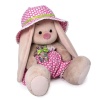 in a hat and with a bear