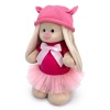 in a dress and cap with ears