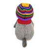 in a striped hat with a scarf