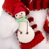 in a scarf with a snowman