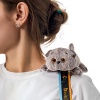 Basik cat with a bow reclining on Velcro