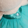 in turquoise skirt and with butterfly