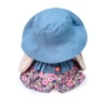 in a denim hat